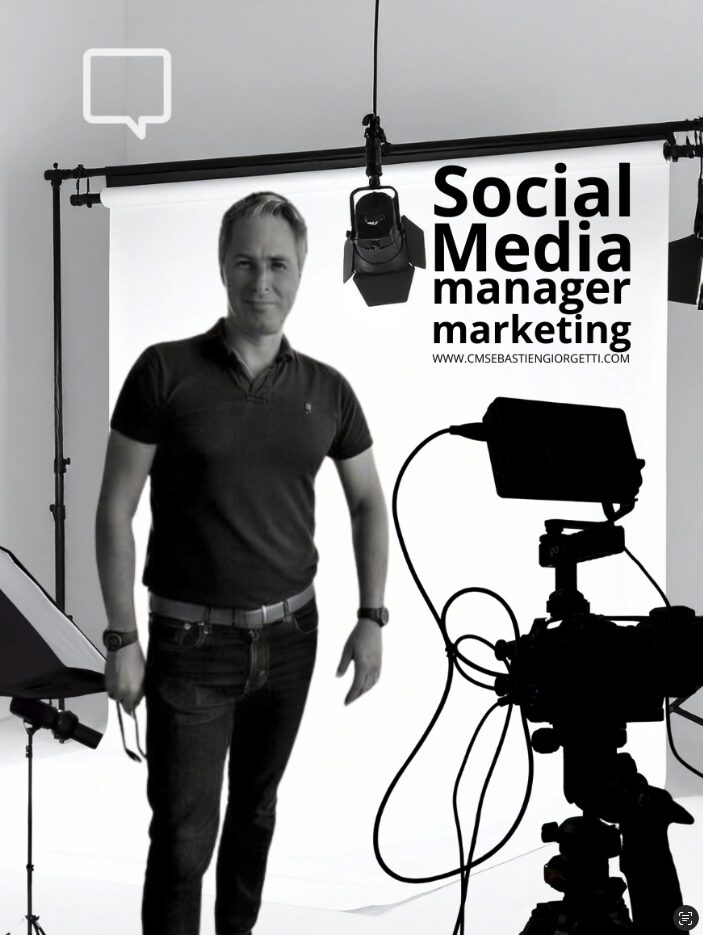 Man standing in front of a backdrop with social media and marketing text, camera equipment visible.