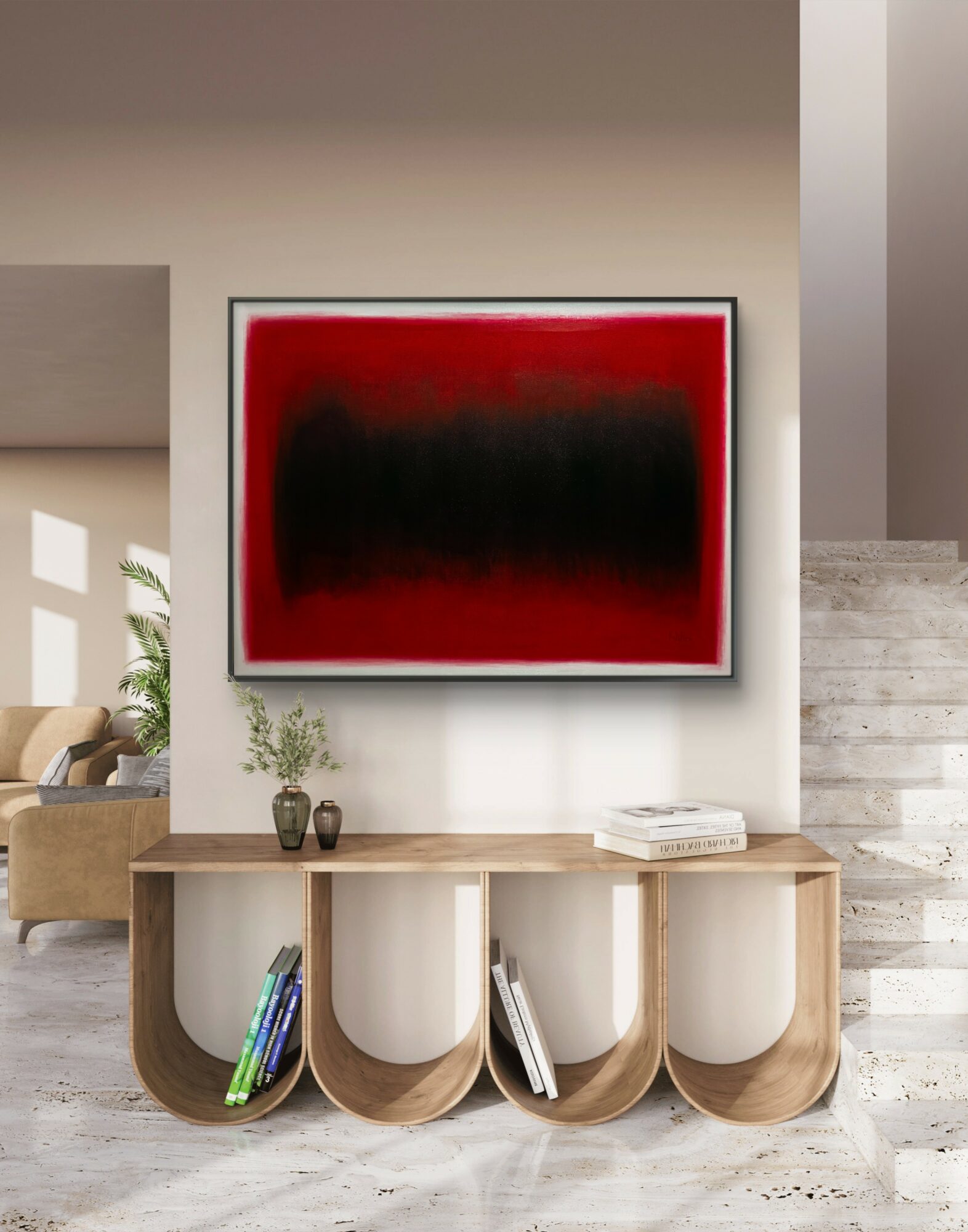 Abstract painting with red and black colors hanging on a wall above a wooden console table.