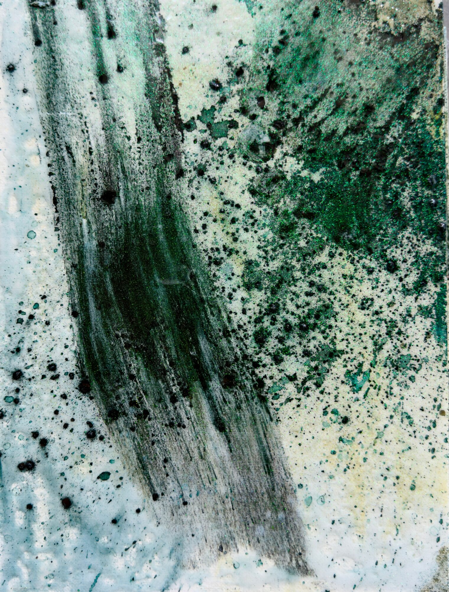 Abstract painting with green, black, and white splatters and streaks.