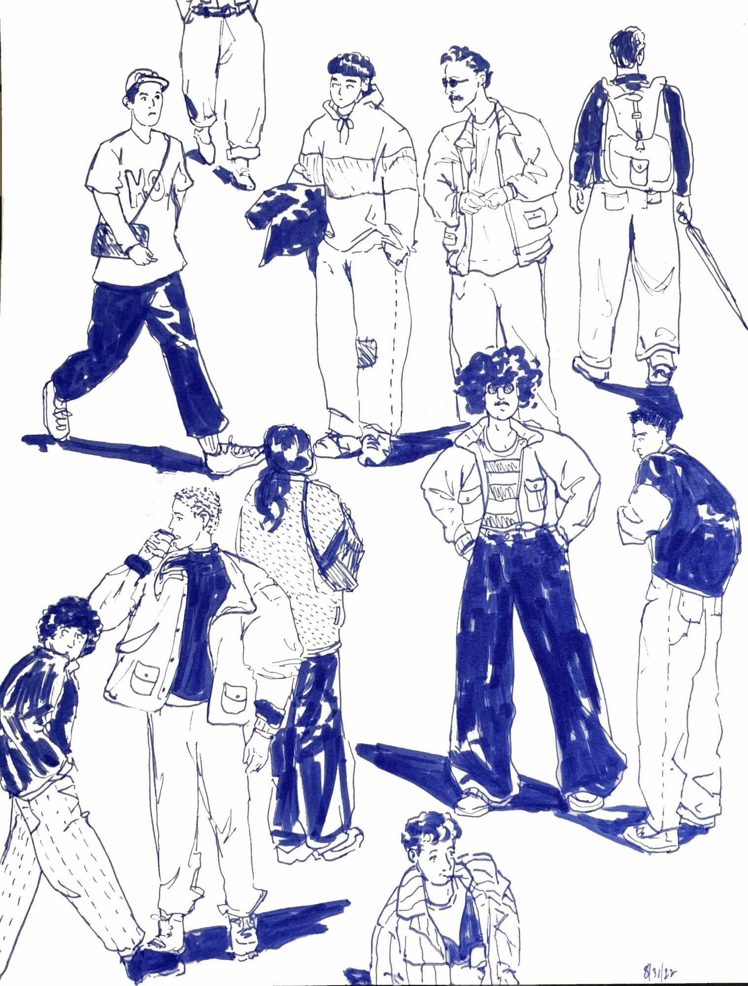 Group of people standing and sitting, some holding bags, in casual clothing, with a person lying on the ground.