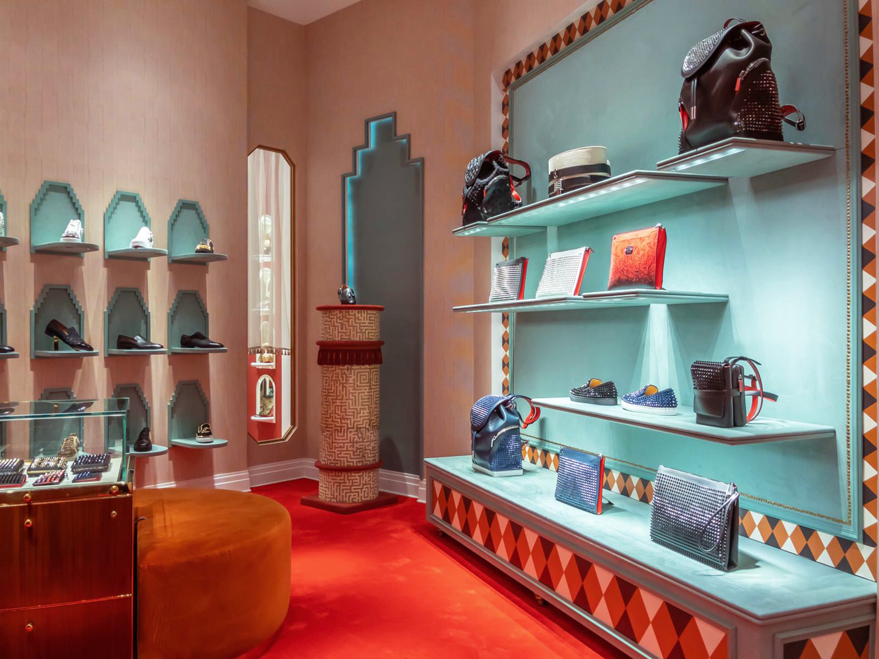Interior of a store with shelves displaying bags, shoes, and accessories, with a colorful wall and decorative elements.