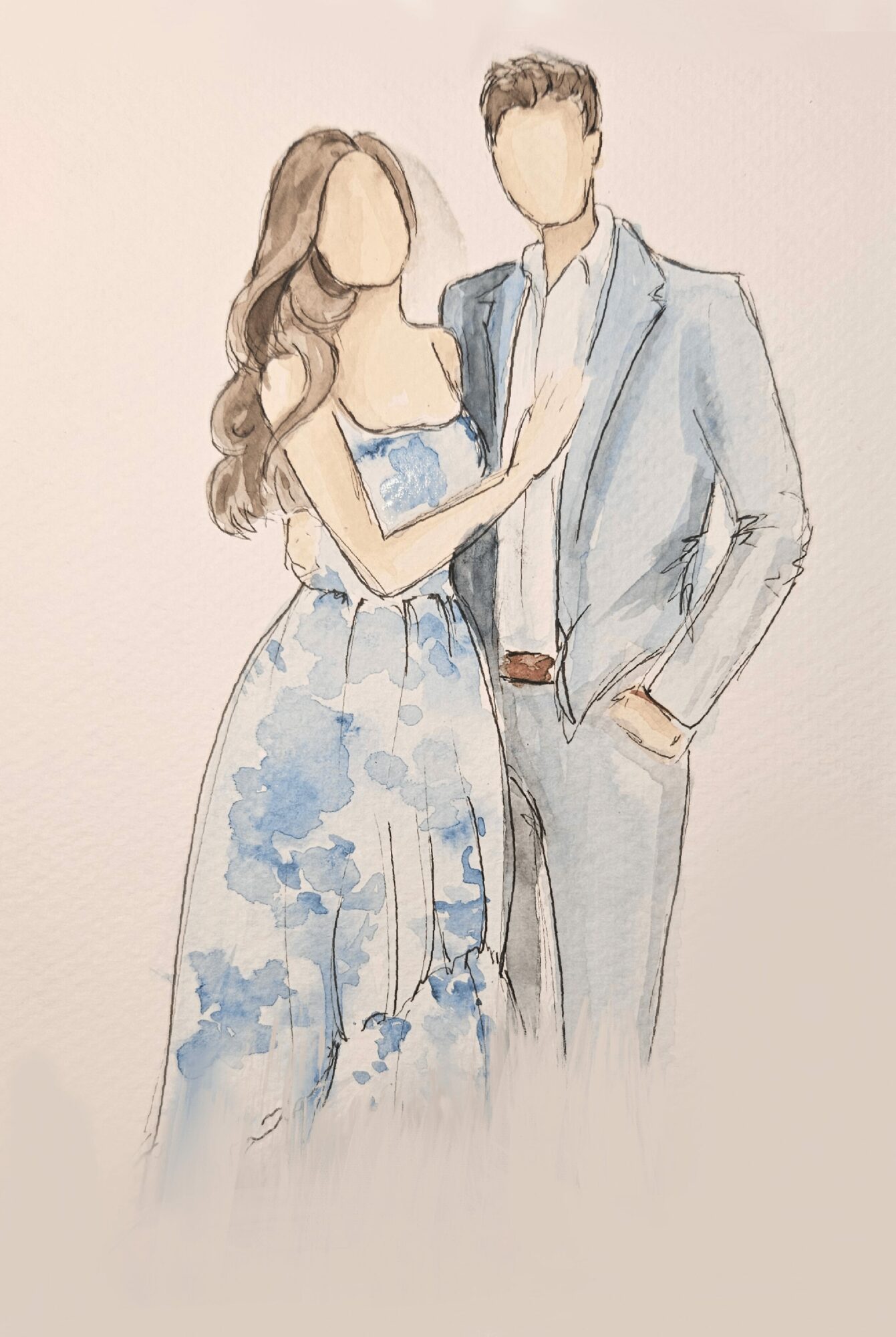 A woman in a blue floral dress and a man in a light gray suit stand close together, with the woman holding the man's arm.