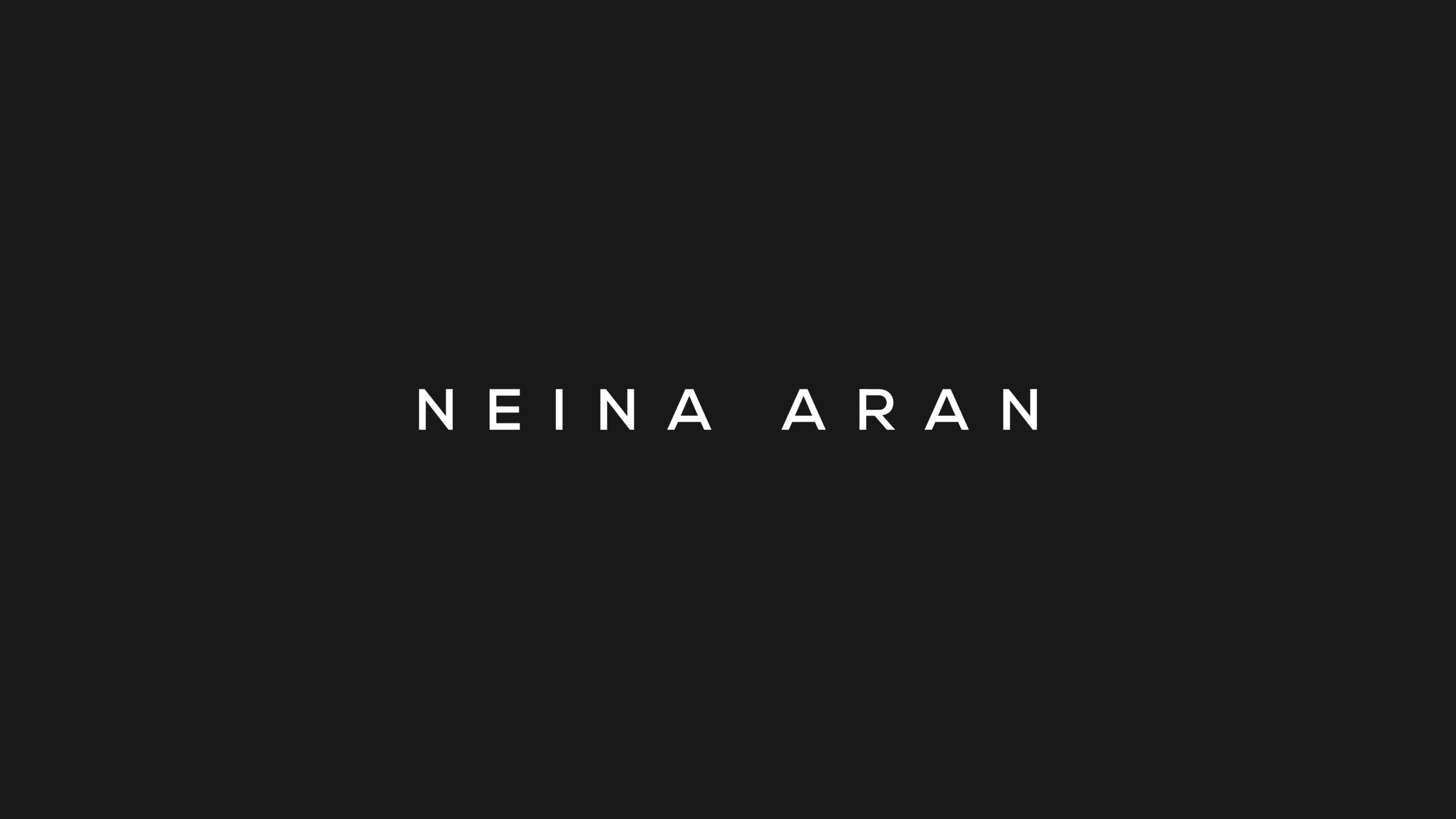 Black background with white text reading 'NEINA ARAN'.
