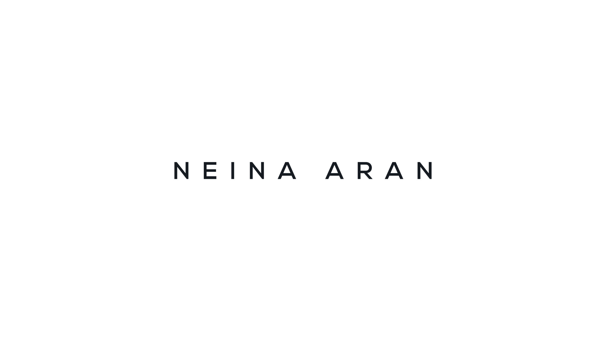 Text displaying 'NEINA ARAN' on a white background.