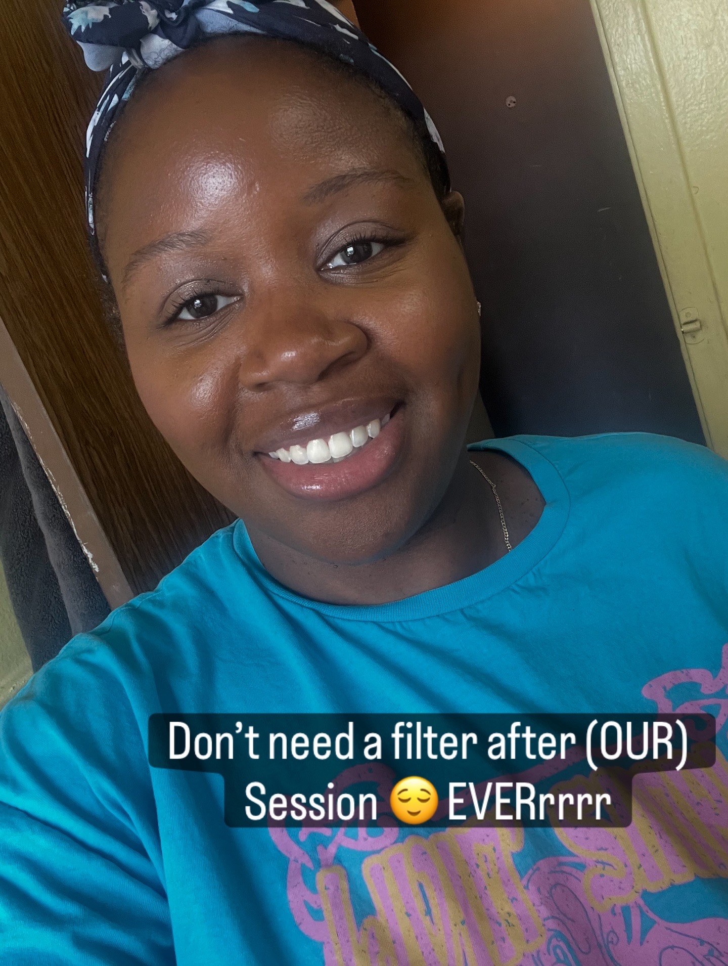 Smiling woman wearing a headband and blue shirt, indoors, with a caption about not needing a filter.