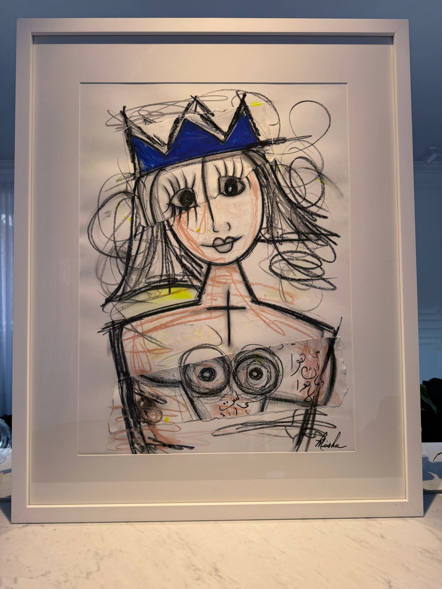 Drawing of a girl with a crown, long hair, and a topless upper body, with large eyes and a smile.