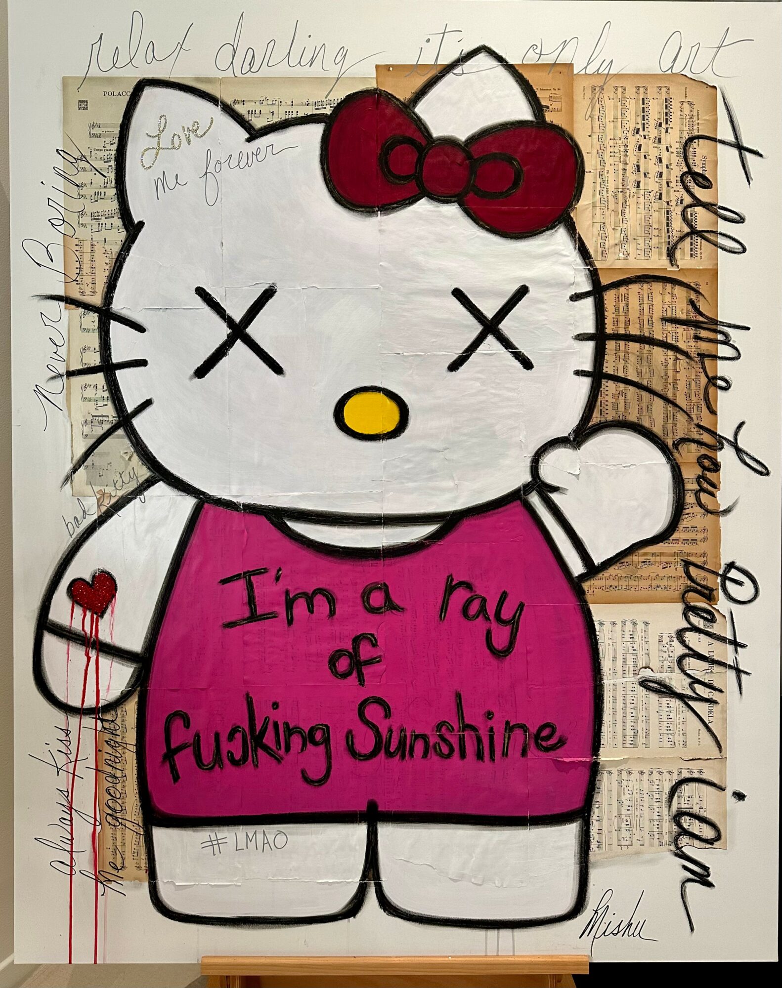 Drawing of Hello Kitty with a red bow, pink shirt, and a heart on her arm, holding a sign with text.