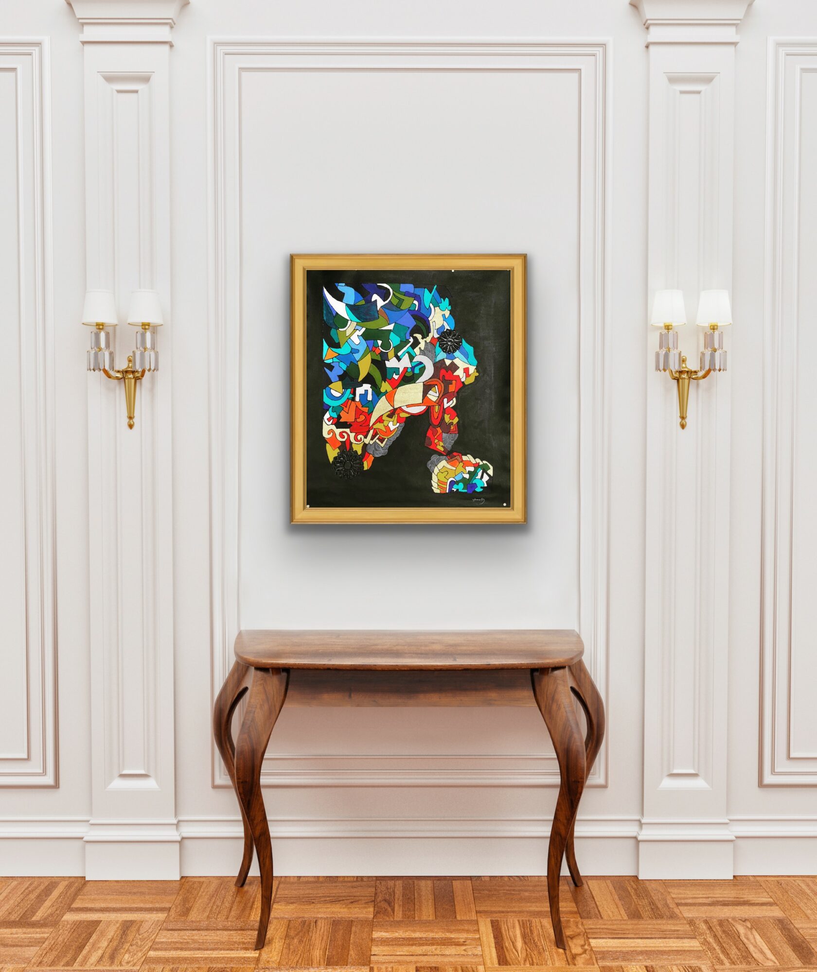 Painting with colorful abstract shapes hangs on a white wall above a wooden table with curved legs, flanked by wall sconces.