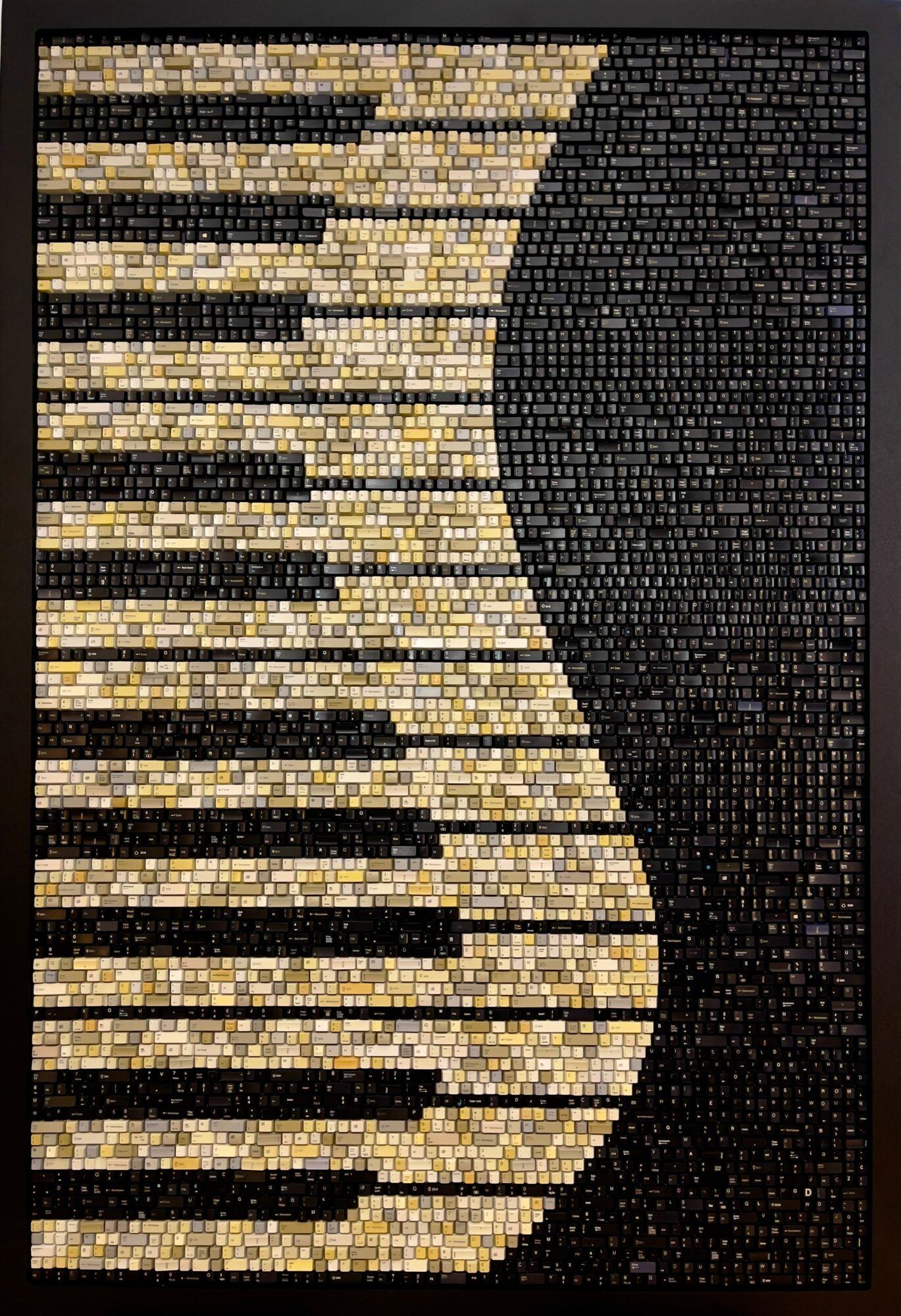 Abstract mosaic with black and beige curved pattern, composed of small square tiles.