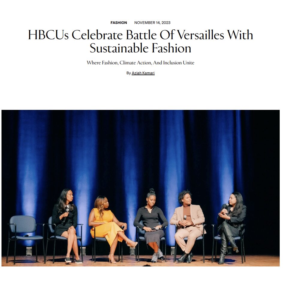 Five women sit on chairs on stage with a blue curtain background, participating in a panel discussion.