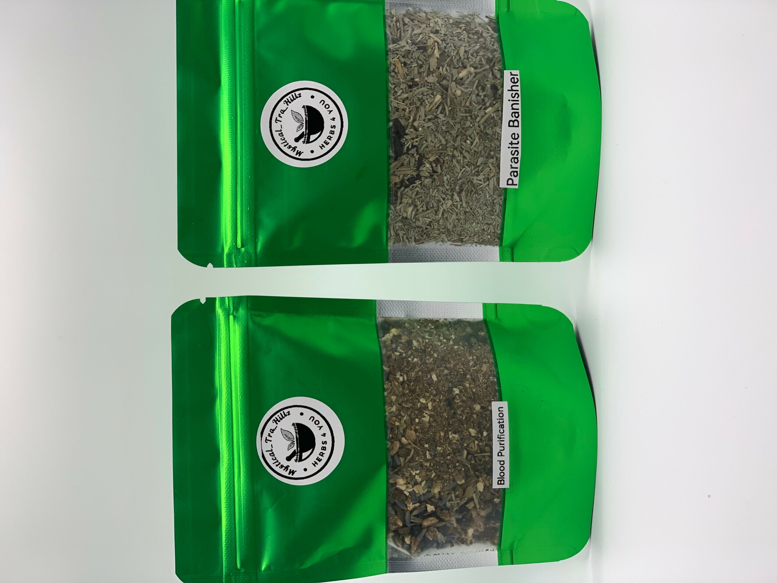 Two green resealable bags with black and white labels, one with a transparent window showing contents, on a white background.