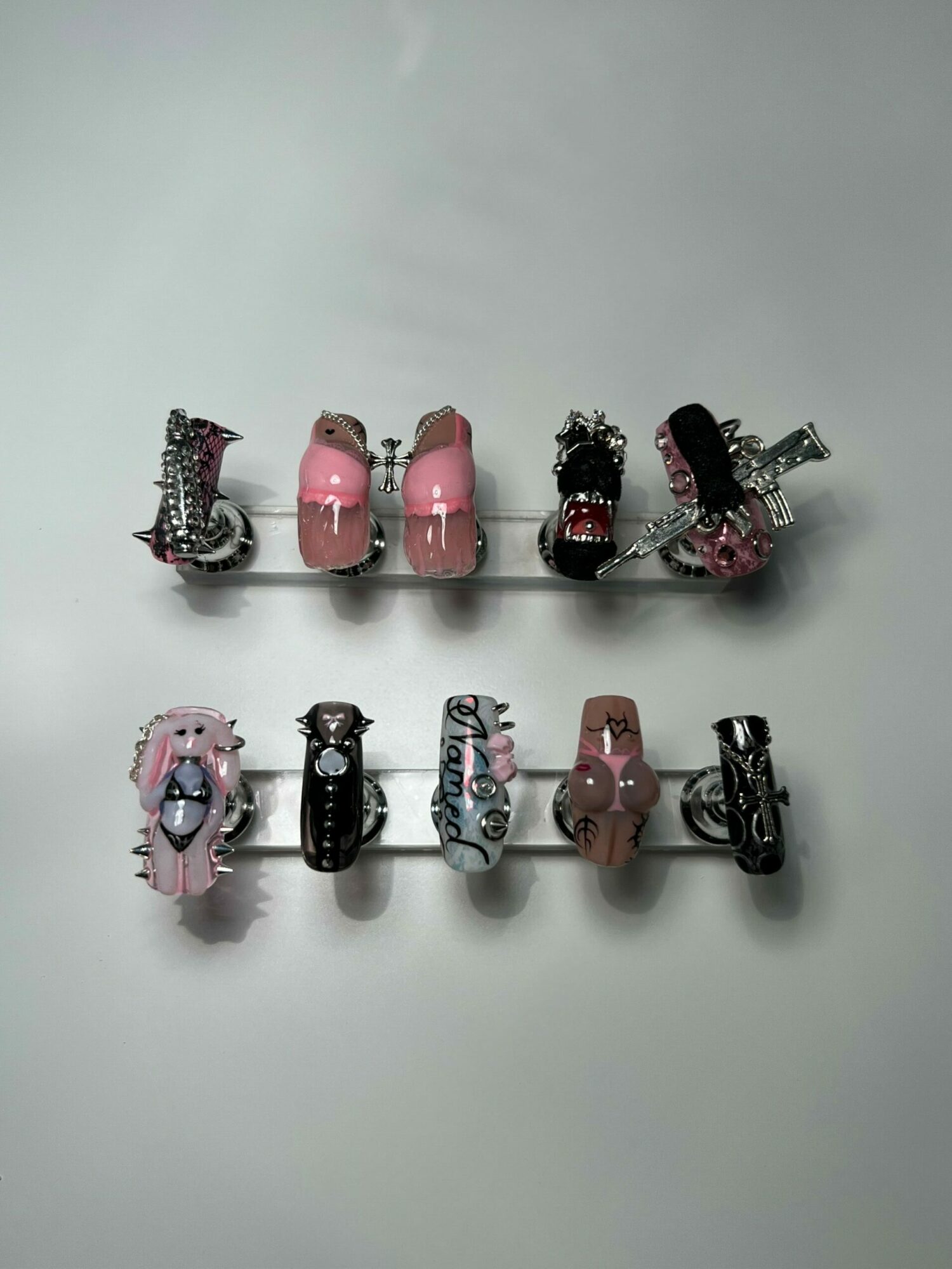 Two vertical rows of colorful hair clips on a white background, with six clips in each row.