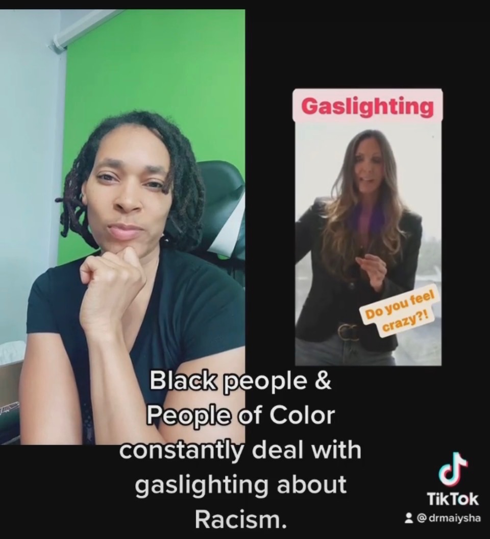 A woman with black hair and a black shirt in front of a green screen, with text about dealing with racism. Word count: 24