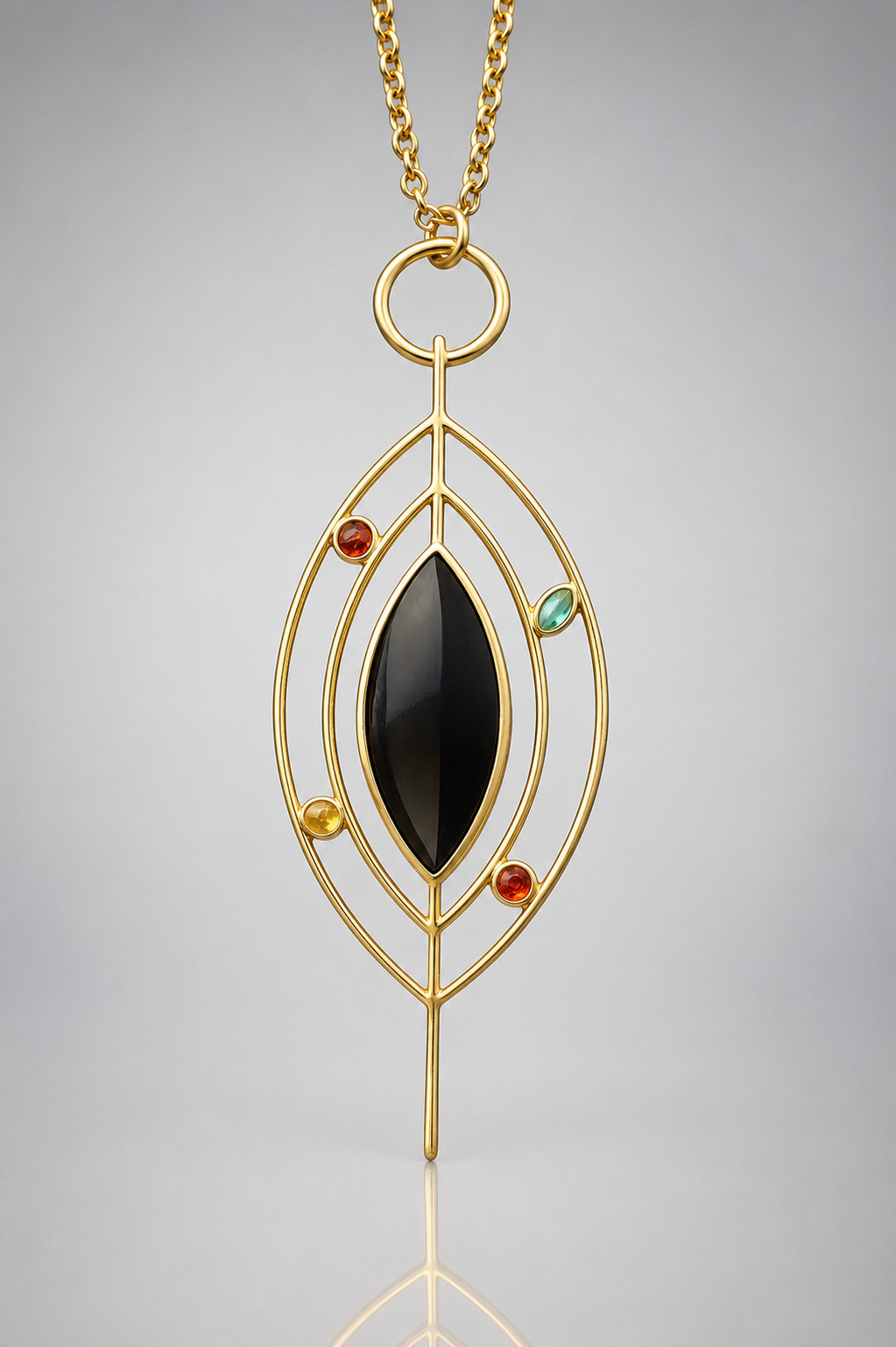 Gold pendant necklace with black central stone and small colored gemstones, hanging from a gold chain.