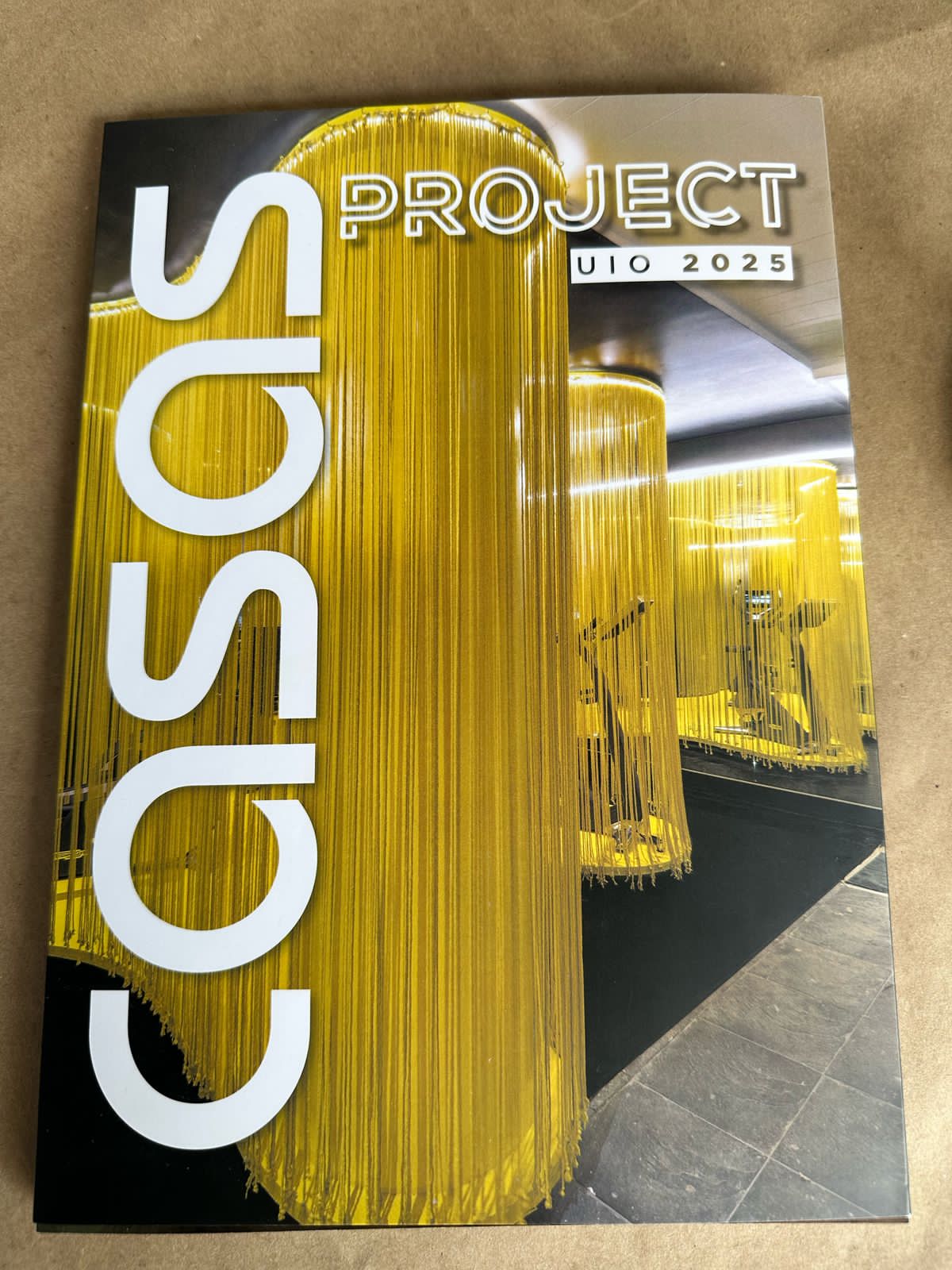 Cover of a magazine featuring large yellow gas cylinders and the text 'GAS' and 'PROJECT' with a modern design.